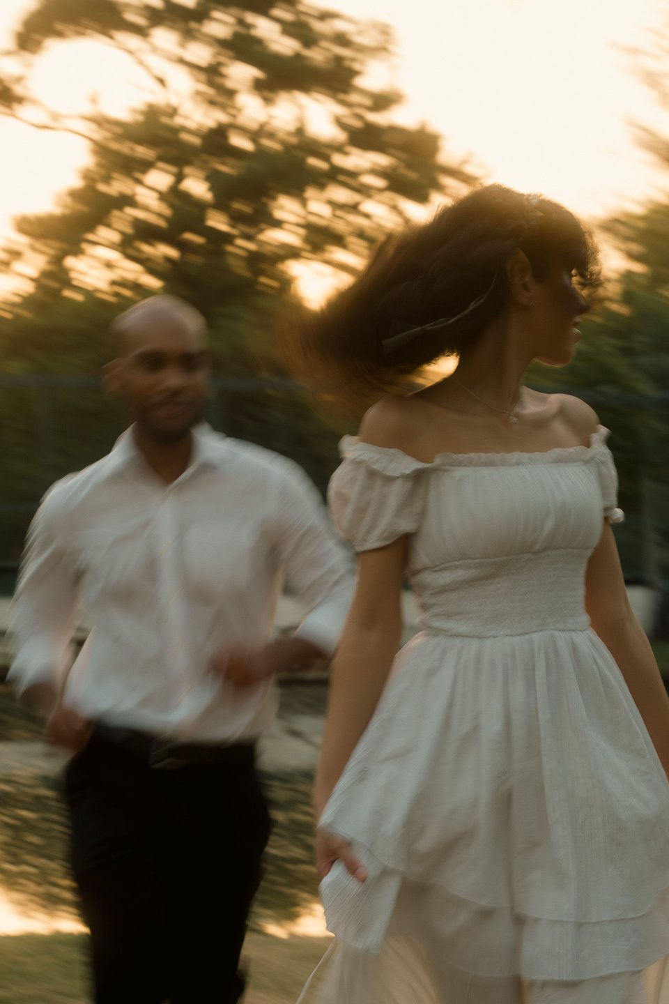 Walking into the light, caught mid-motion.